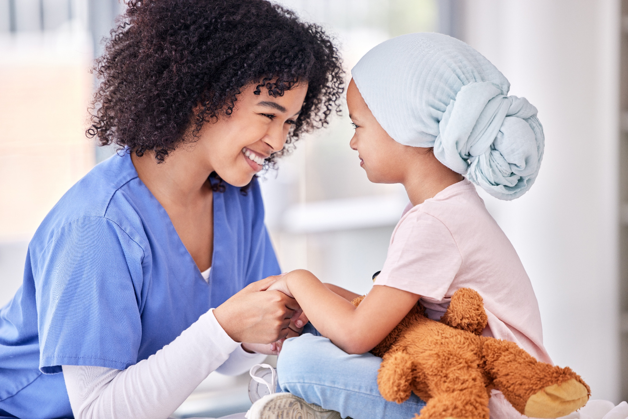 Care professional supporting a young patient